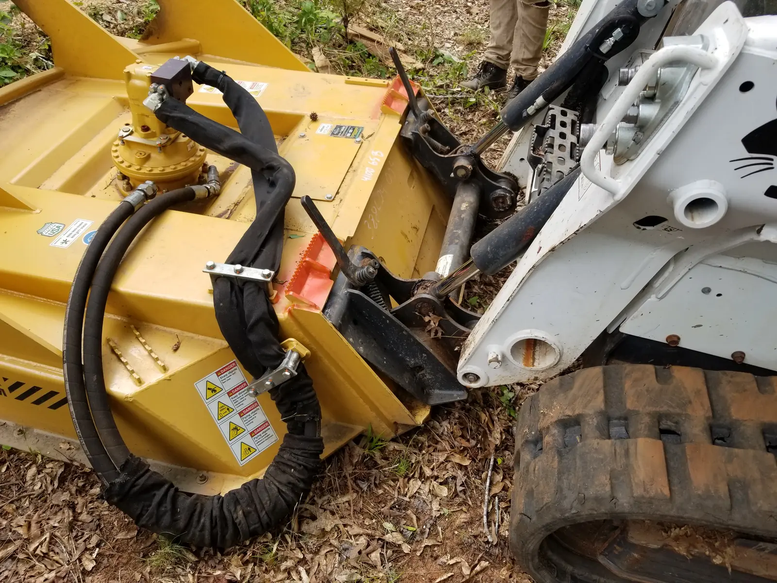 Close-up of the forestry mulcher head mounted on the Bobcat